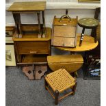 A 19th century oak purdonium; oak drop lead occasional table; an oak nest of two tables;