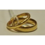 A 22ct gold 5mm wedding band, size M 1/2; another 2mm size N 1/2 10.
