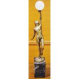 An Art Deco style bronze, of a scantily clad female bather holding aloft an orb,