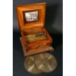 A 19th century walnut and marquetry table-top polyphon, horizontal movement playing steel disks,