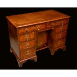 A Queen Anne style walnut kneehole desk,