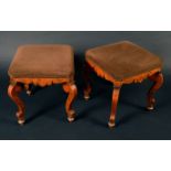 A pair of Dutch walnut and marquetry stools, stuffed over upholstery, shaped aprons, scroll legs,