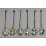 A set of six Elizabeth II silver-gilt and enamel seal top coffee spoons,