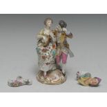 A late 19th century German porcelain figure group, of a courting couple in 18th century dress,