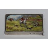 A Victorian silver rectangular vesta case, the hinged cover enamelled with huntsman and hounds, 5.