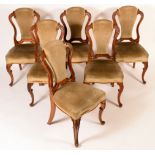 A set of six Victorian walnut dining chairs, cartouche shaped backs carved with scrolling acanthus,