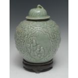 A Chinse celadon ovoid wine jar and cover,