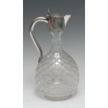 A Victorian silver mounted clear glass globular claret jug,