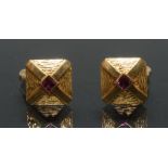 A pair of retro 1970's 18ct gold vibrant pink ruby inset crossed shield panel cufflinks,