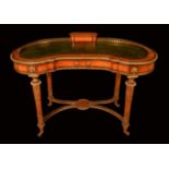 A Victorian gilt metal mounted satinwood and rosewood kidney shaped desk,