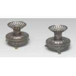 A pair of French silver desk top candlesticks, pierced sconces,