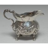 An early Victorian silver cream jug, of substantial gauge and mid-18th century design,