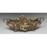 An Art Nouveau style boat shaped flower trough, pierced and cast with flowers and scrolls,