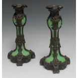 A pair of 19th century Rococo Revival bronze and apple green porcelain candlesticks,