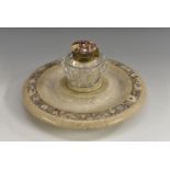 A 19th century polished stone inkwell on stand, set with banded of fossils, 21.5cm diam, c.