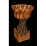 A 19th century saltglazed stoneware garden planter, naturalistically modelled as a tree trunk,