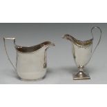 A George III silver helmet shaped creamer jug, high loop handle, square base, 14cm high,
