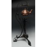 An Arts and Crafts copper and wrought iron kettle on stand, in the manner of W.A.