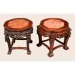 A near pair of Chinese rosewood jardiniere stands,