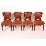 A set of eight William IV/early Victorian mahogany dining chairs, arched shield shaped backs,
