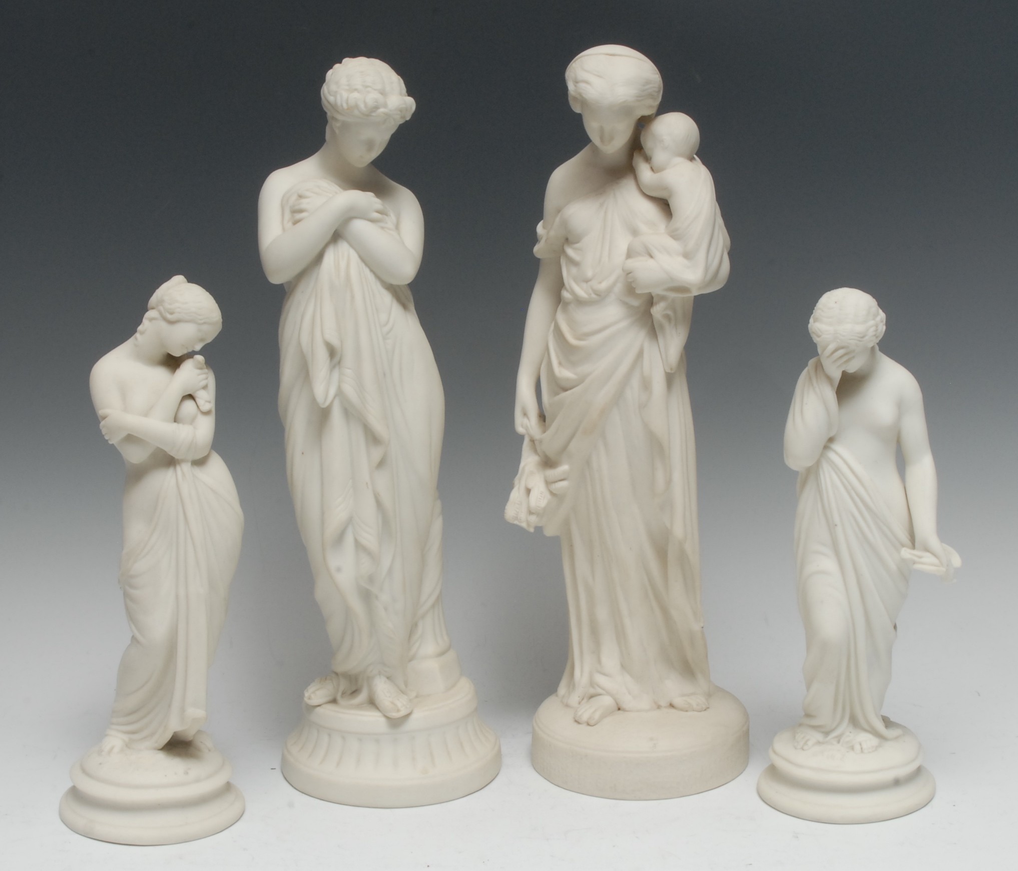 A pair of Parian figures, Sorrow and Joy, the classical maidens stands, semi-nude,