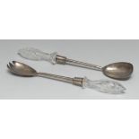 A pair of Edwardian silver salad servers, hobnail-cut clear glass hafts,