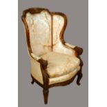A Louis XVI style wingback armchair, stuffed over upholstery, squab cushion,