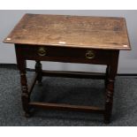 An early 18th century oak side table, oversailing rectangular top above a frieze drawer,