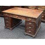 A 19th century Gothic Revival oak pedestal desk, c.1880.