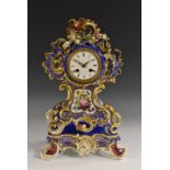 A 19th century French porcelain cartouche-shaped mantel clock,