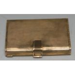 A Continental silver-gilt rounded rectangular vanity case, engine turned overall,