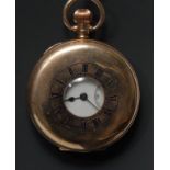 A 9ct gold cased half hunter pocket watch, white enamel dial, bold Roman numerals, minute track,