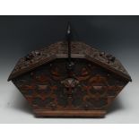 A 19th century Gothic Revival oak coal scuttle, decorated with strapwork,