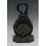 A 19th century cast iron door stop, as a lion peering through acanthus, loop handle,