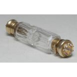 Asprey - a Victorian silver-gilt and rock crystal mounted double-ended scent bottle,