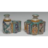 A Persian tin-glazed stoneware inkwell, as a stylized flower,