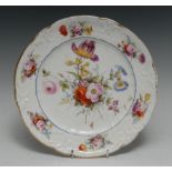A Nantgarw shaped circular plate, the centre painted with a spray of country flowers,