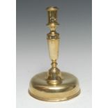 A mid-17th century brass candlestick, cylindrical sconce, domed spun base, 23.5cm high, c.