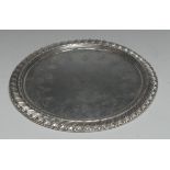 An 18th century Portuguese silver circular salver, gadrooned border,