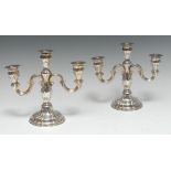 A pair of German silver three-light candelabra, fluted and embossed in the Rococo taste, 19.