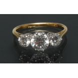 A diamond trilogy ring, central old brilliant cut diamond approx 1.