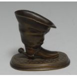 A 19th century brown-patinated bronze novelty table vesta, as a spurred boot,