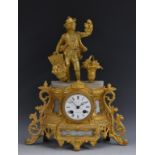A French figural mantel clock, the 8cm enamelled dial with Roman numerals,