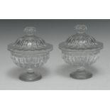 A pair of 19th century Le Creusot clear glass lobed pedestal sweetmeat jars and covers,