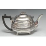 A George III silver boat shaped teapot, flush-hinged domed cover with fluted knop finial,