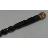 A bone 'momento mori' walking stick handle, carved as a skull, associated Anglo-Indian shaft,