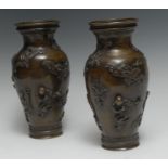 A pair of 19th century Chinese bronze ovoid vases, cast and applied with boys and phoenix, 22.