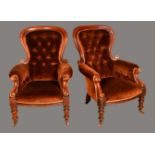 A pair of Victorian mahogany spoonback armchairs, deep button stuffed over upholstery,