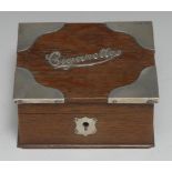 An Edwardian silver mounted oak rectangular table top cigarette box, hinged cover, 13cm wide,