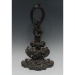 An early Victorian cast iron door stop, loop handle above acanthus scrolls, 42cm high,